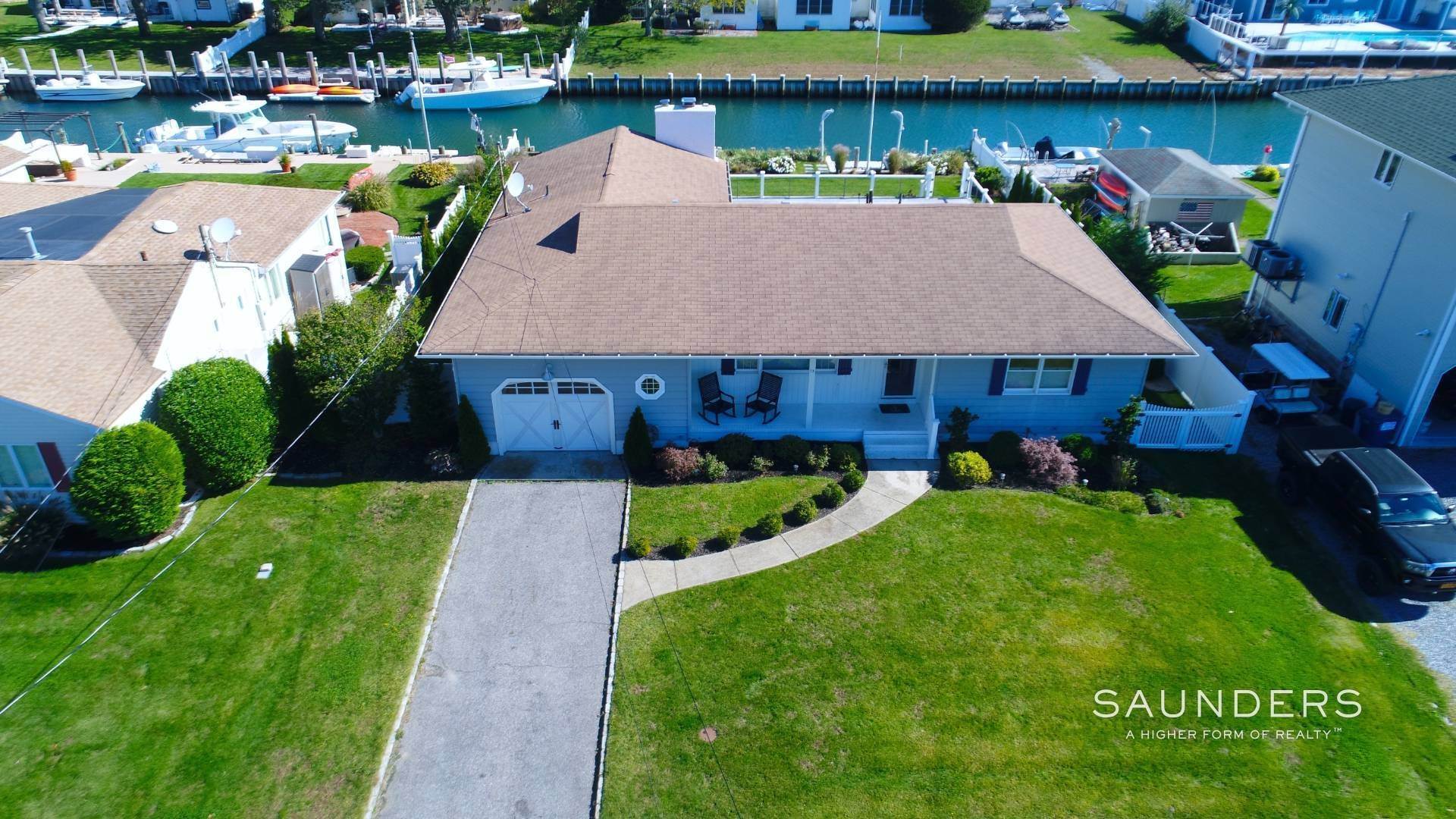 1. Single Family Homes at Hampton's Waterfront Rental - Steps To Private Beach 13 Marlin Road, East Quogue, NY 11942