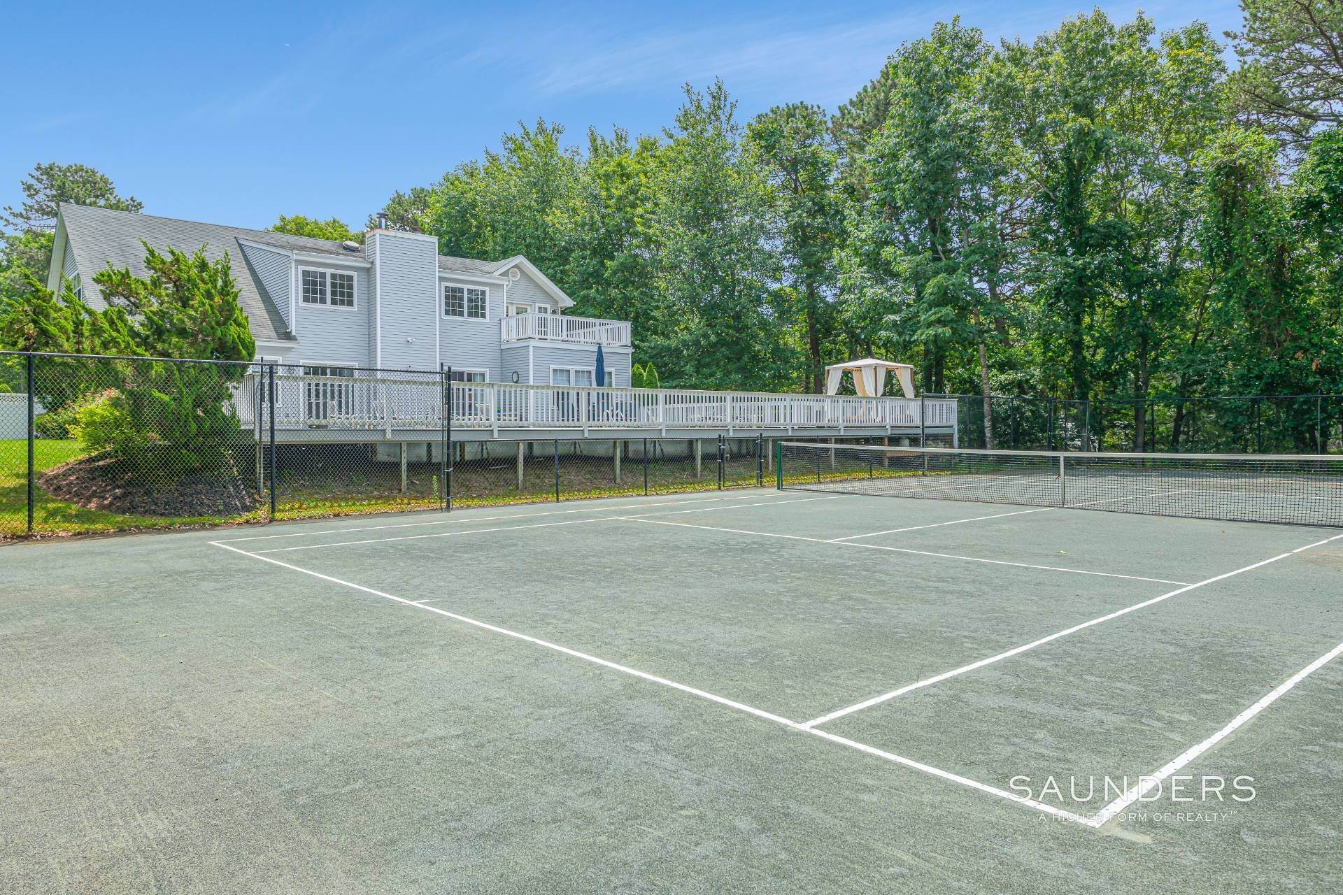 29. Single Family Homes for Sale at Quogue Post Modern With Tennis 77 Whippoorwill Lane, East Quogue, NY 11942