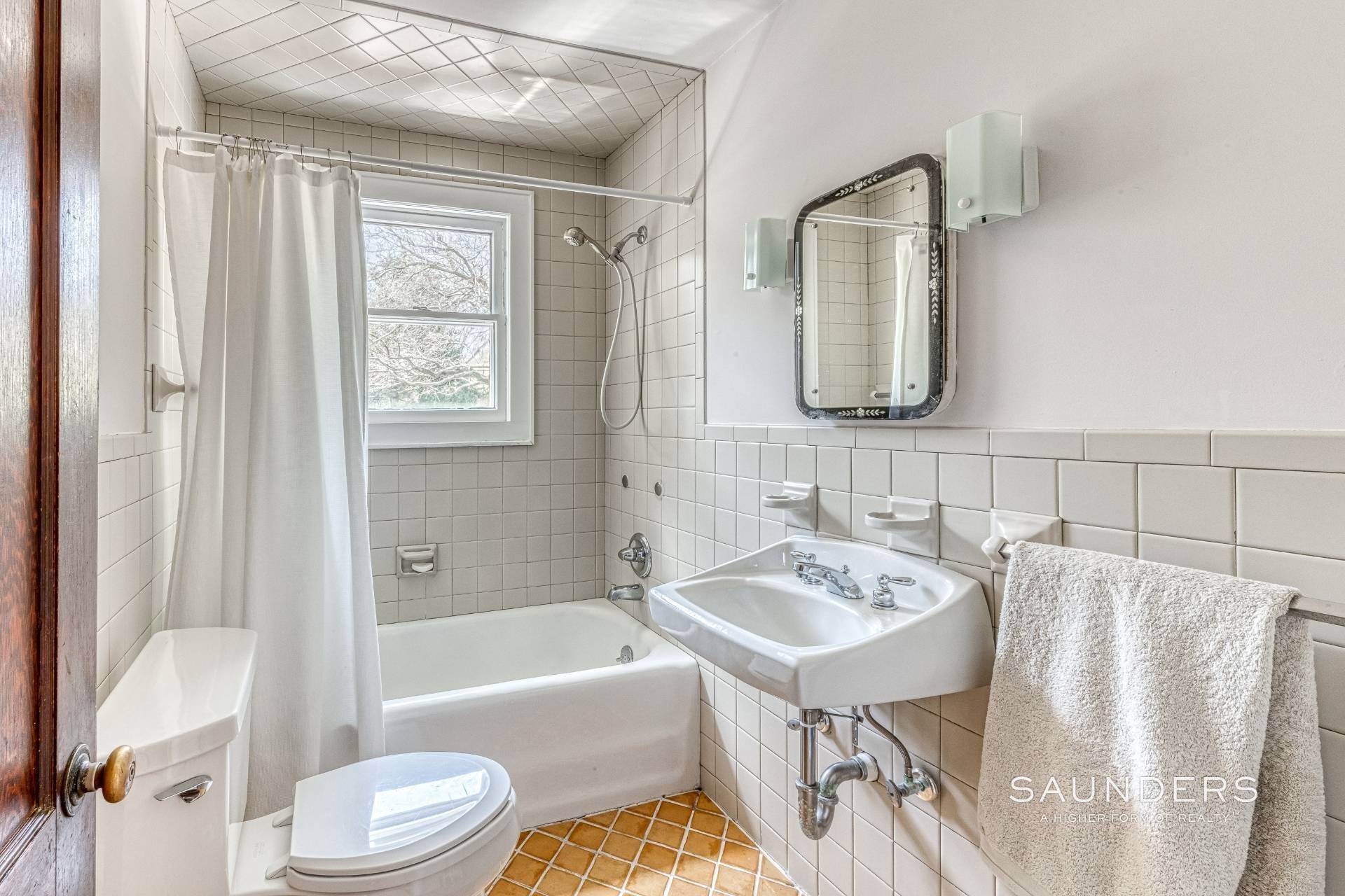 26. Single Family Homes for Sale at Shelter Island Renovated 1931 Bungalow With Pool 23 Smith Street, Shelter Island, NY 11964